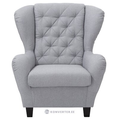 Light gray armchair follow delavita alexandra&#39;s strong beauty flaws