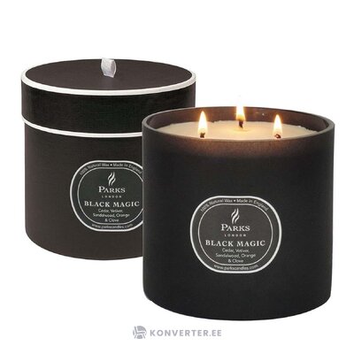 Scented candle black magic with beauty flaws.