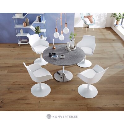 White round dining table on a metal leg