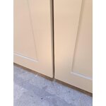 Beige cabinet (jodie) with cosmetic flaws.