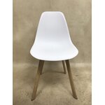 White-brown plastic chair with beauty defects, sample of the hall