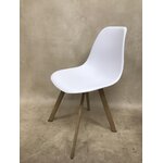 White-brown plastic chair with beauty defects, sample of the hall