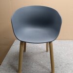 Dark gray chair mork (tomasucci) intact, hall sample, with cosmetic defects.