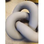 Beige decorative shape knot (cooee design) with beauty flaws.